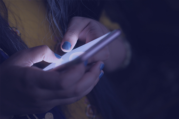 Close up of hands and mobile device