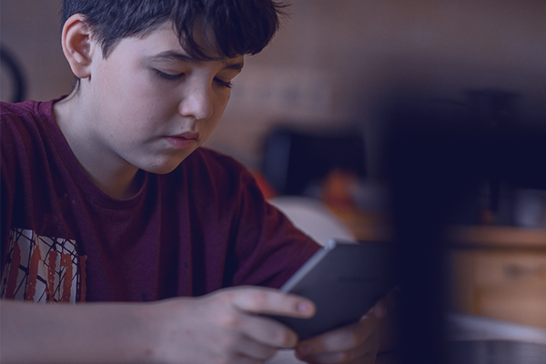 Youn boy on mobile device