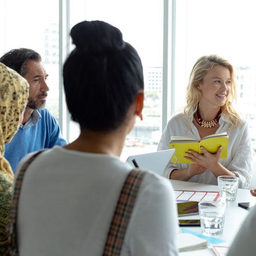 People collaboratingat a meeting